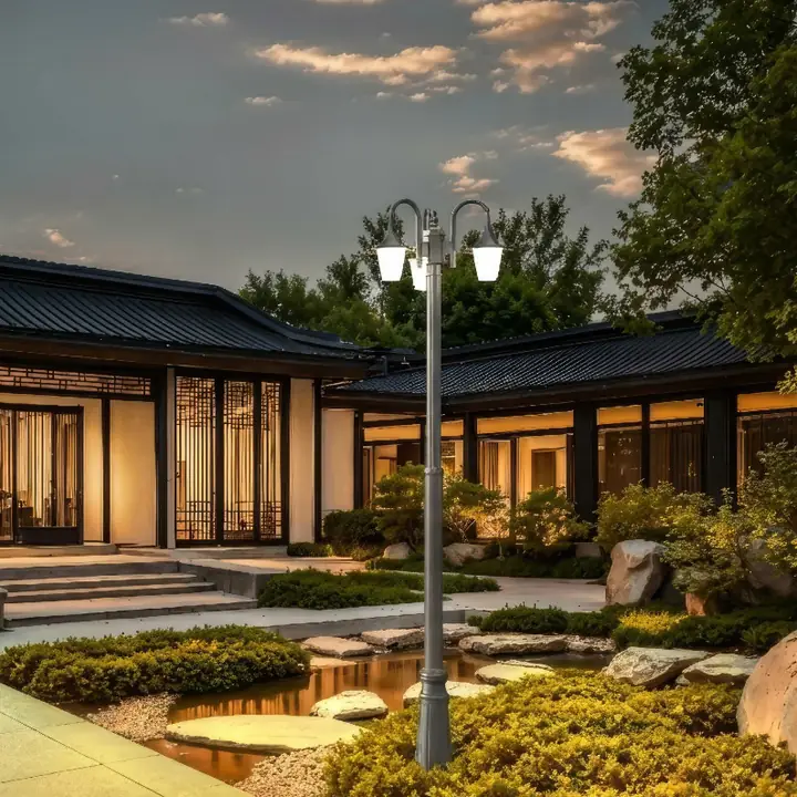 Camp-2 post-top lanterns lining a landscaped driveway