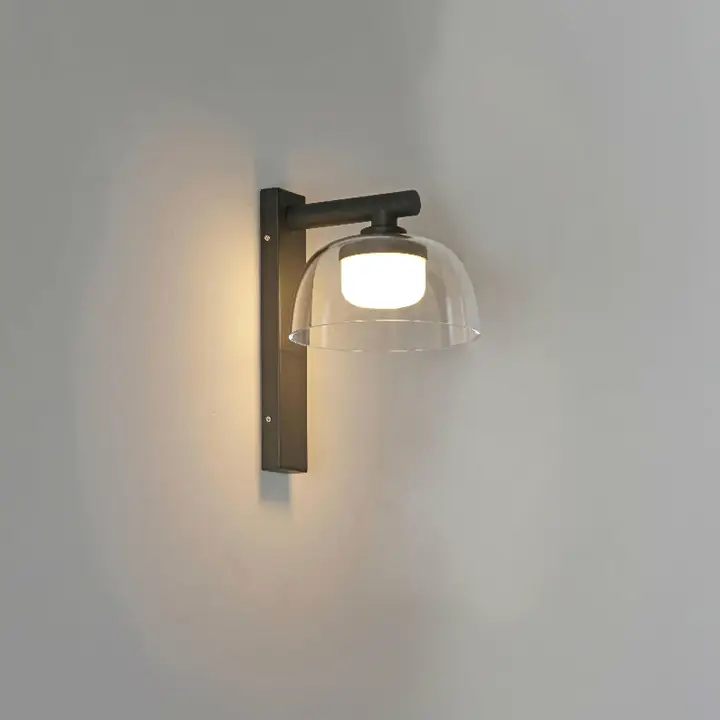 Leo-2 domed sconce on a pale interior wall