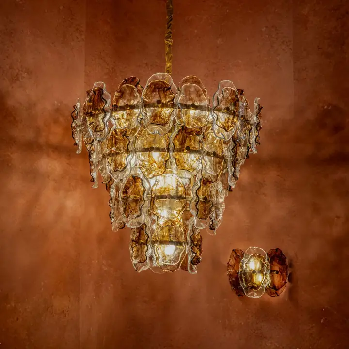 Lithos chandelier with amber glass shades over a warm wall